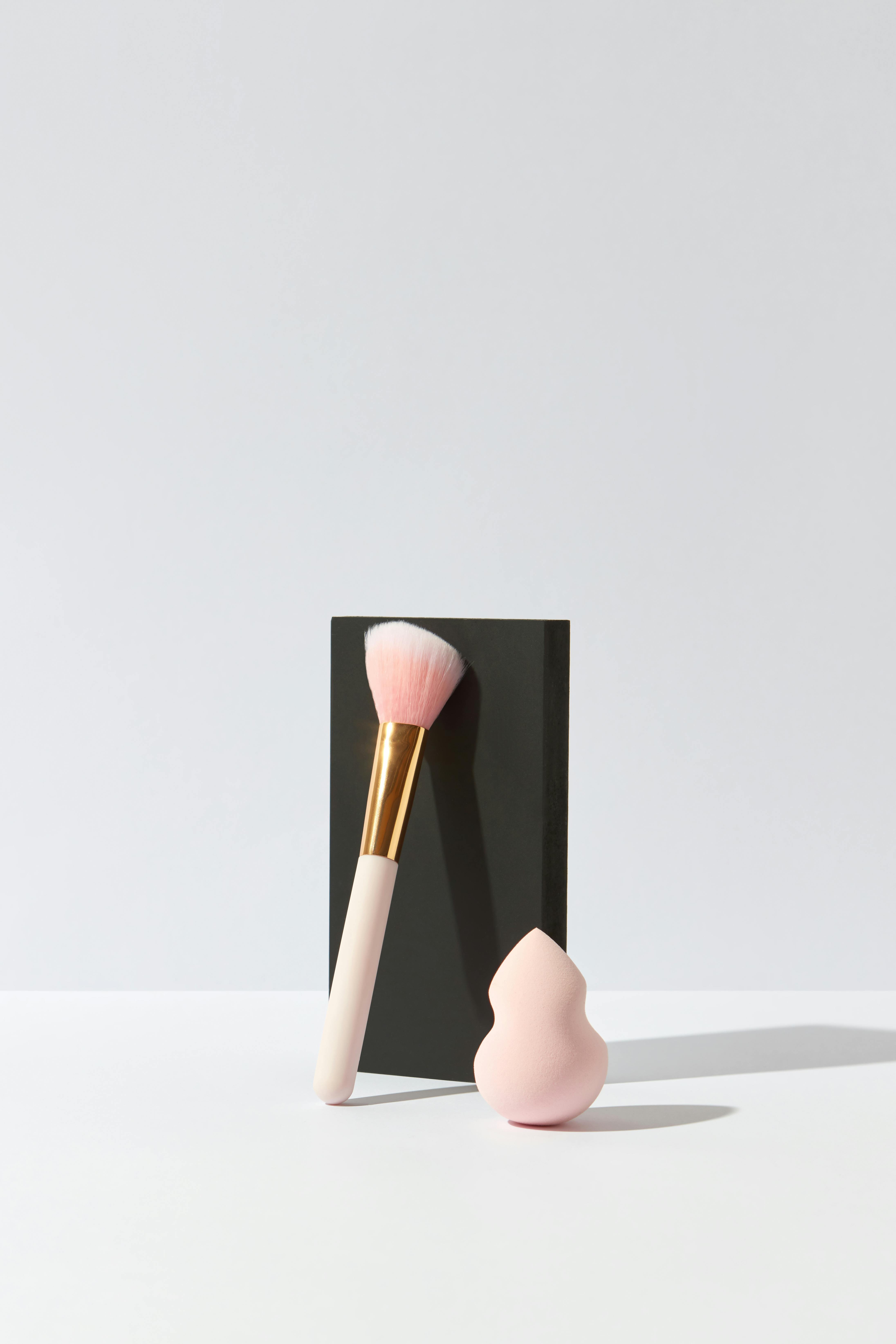 Beauty blender being used to apply makeup