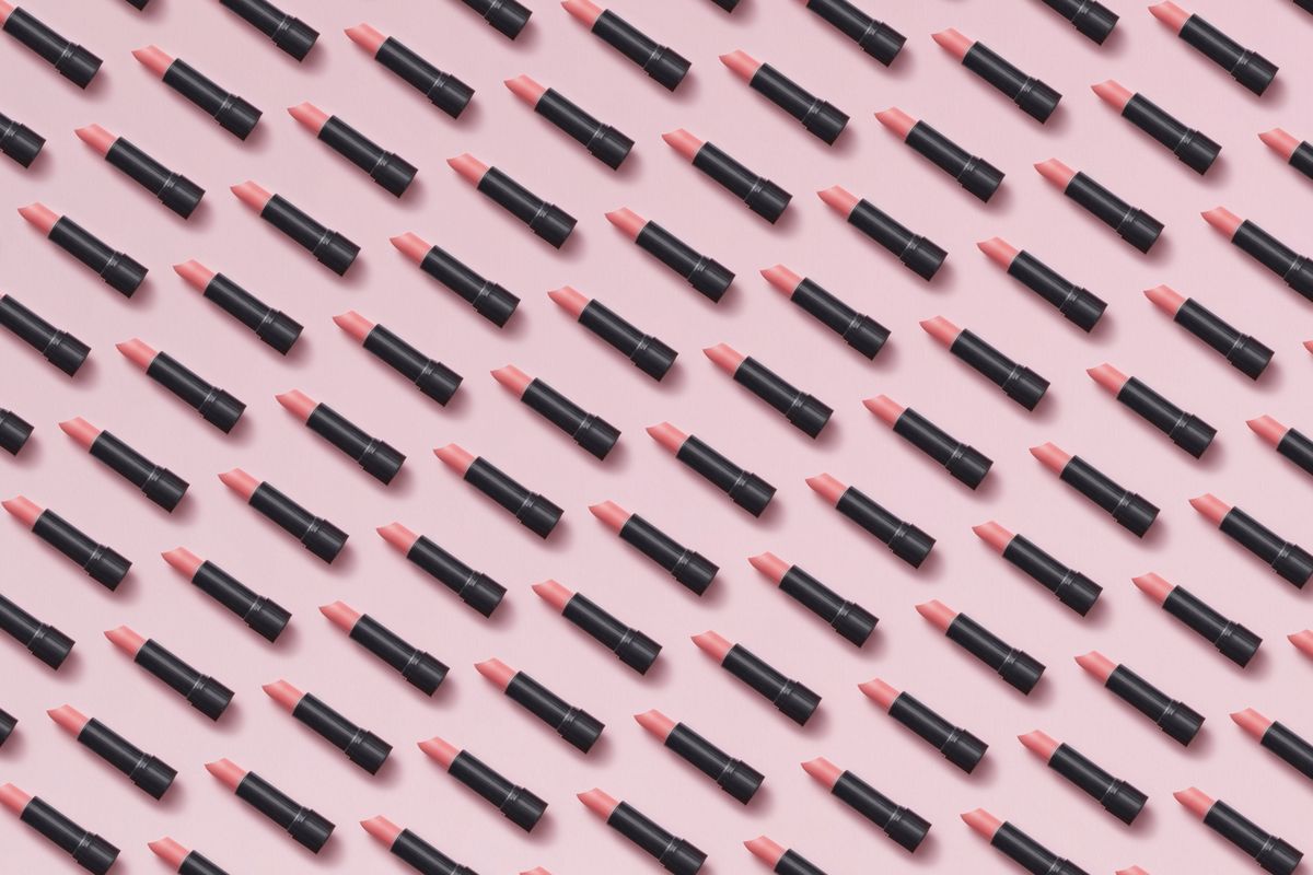 Pink lipstick beauty flat lay