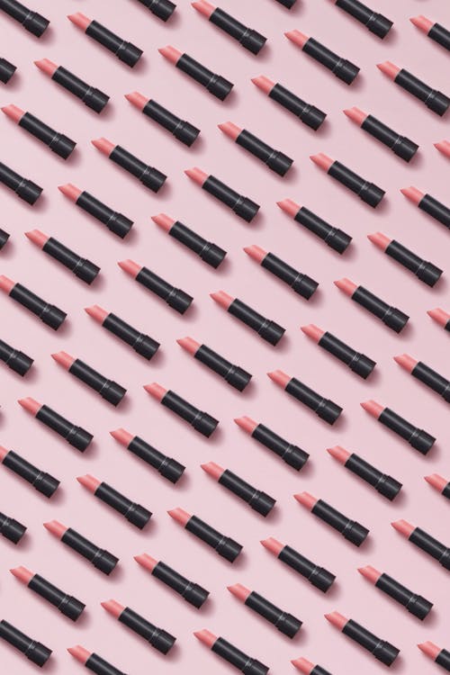 Free Arranged Lipsticks on Pink Surface Stock Photo