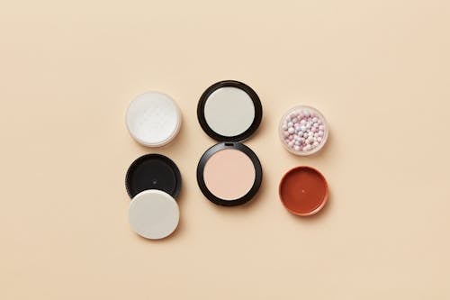 Cosmetic Products on Yellow Surface