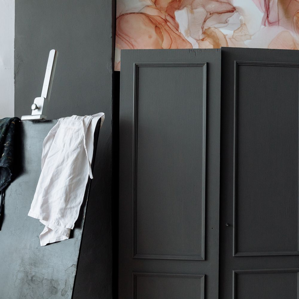 Kitchen Spraying in West Hackney — a decorator at work mid-project