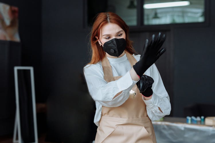 Woman In Mask, Gloves And Apron