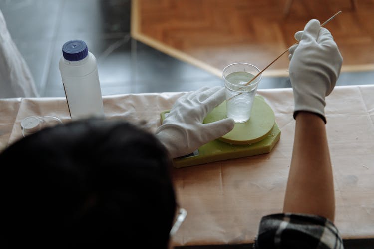 Man Mixing The Resin