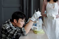 Man Carefully Mixing the Resin