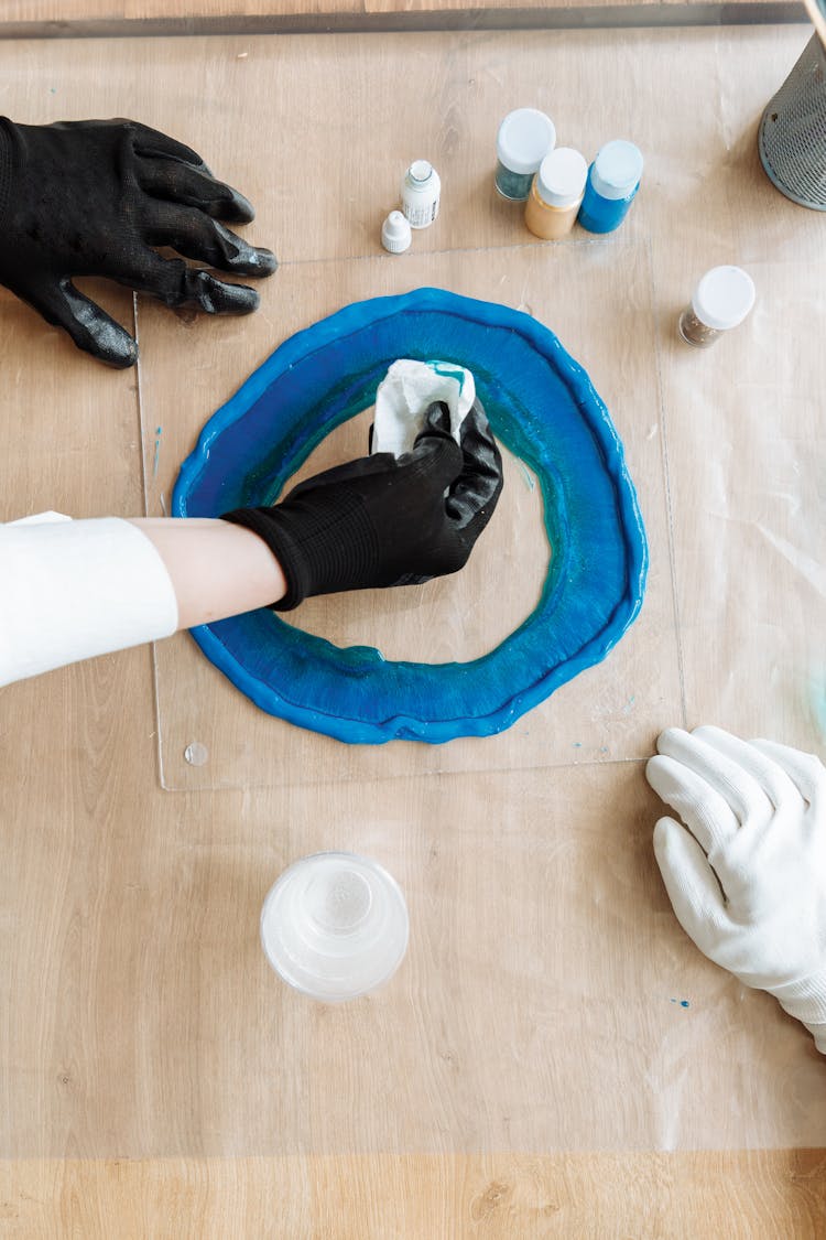 
A Person Making A Resin Art