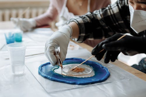 People Experimenting with Colored Chemicals