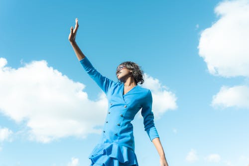 A Woman Wearing a Blue Dress 