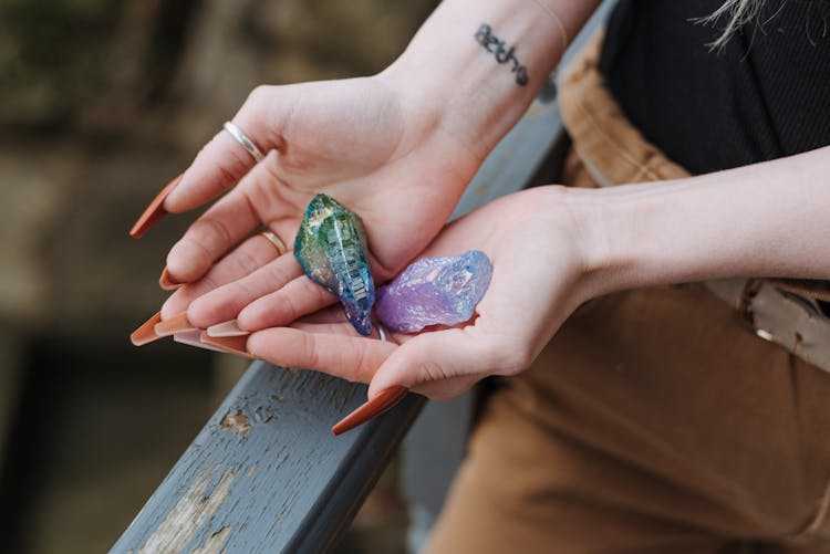 Crop Woman Showing Opals In Hands