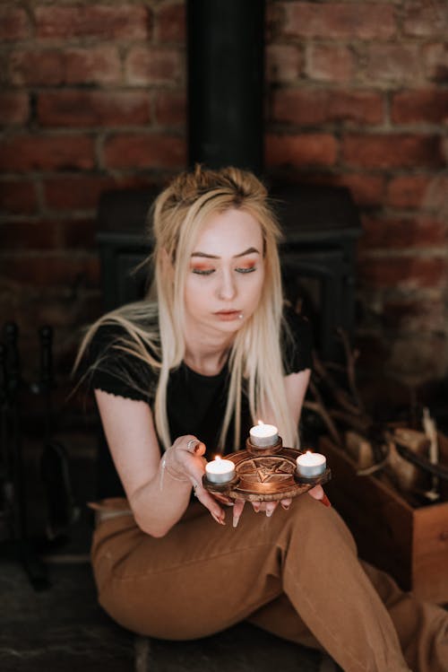 Enigmatic woman with burning candles