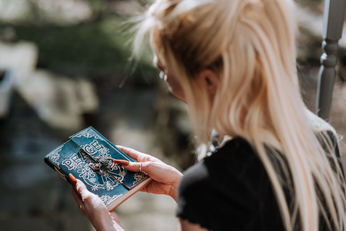 Soothsayer with magic notebook with runic character peace