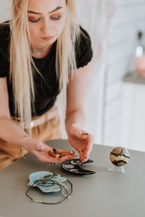 Enchantress with long hair preparing magic items for prediction