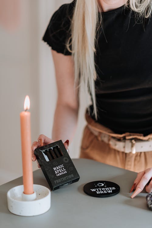 Woman preparing for ritual with witch items