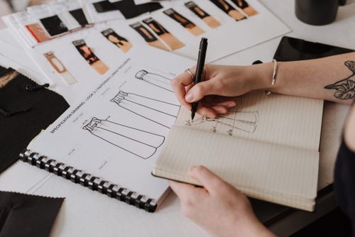 Fashion designer sketching a dress