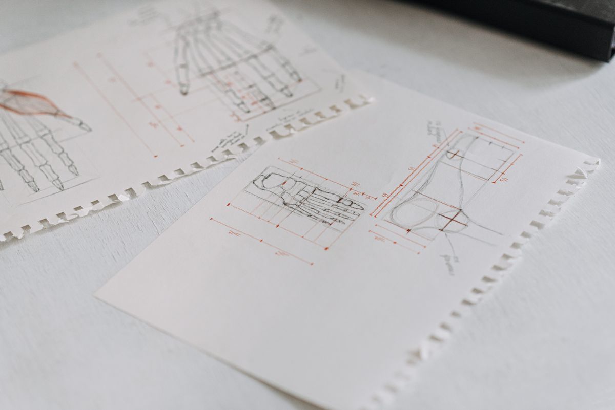 Close-up of detailed technical drawings on white paper sheets