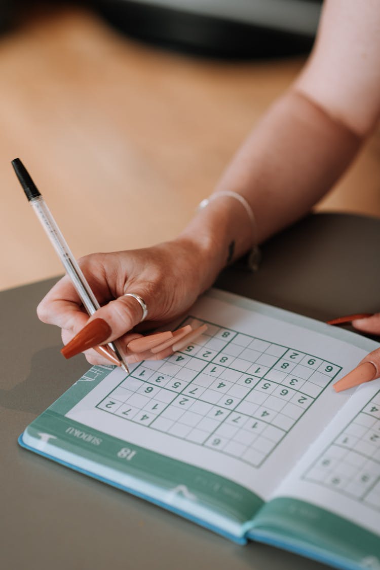 A Person Solving A Puzzle 