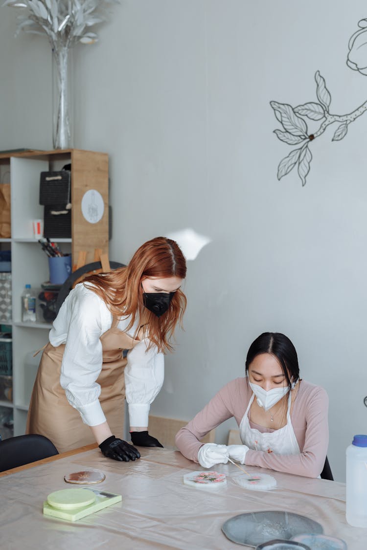 Women In Face Masks Working On An Art Project