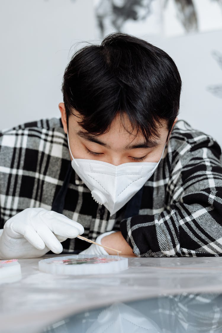 A Man Engaged In Resin Art