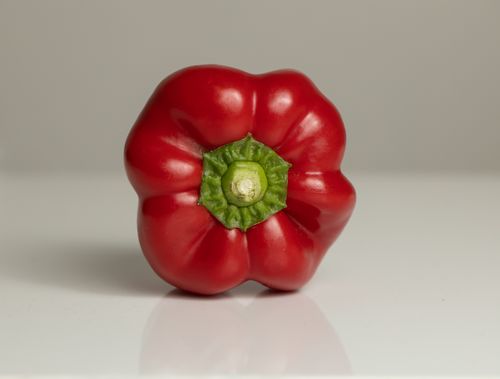 Free Close-up of a fresh red bell pepper showcasing vibrant colors and texture. Stock Photo
