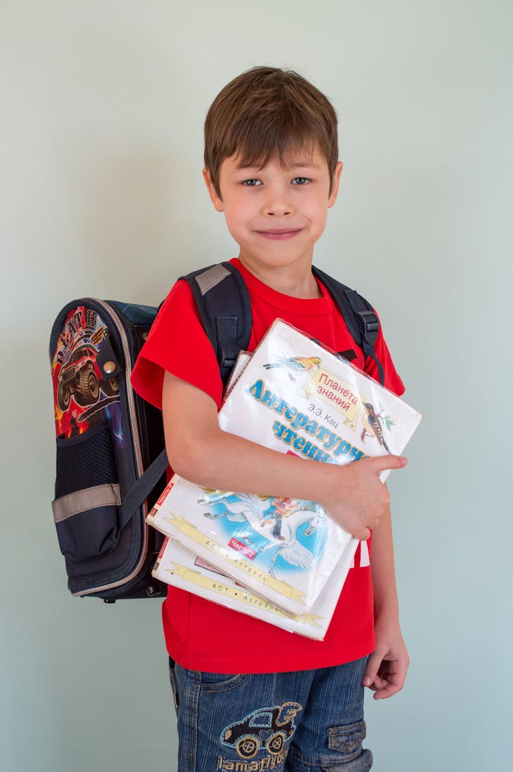 Little Boy With Backpack And Textbooks