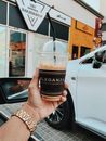Person Holding Iced Coffee in Clear Plastic Cup