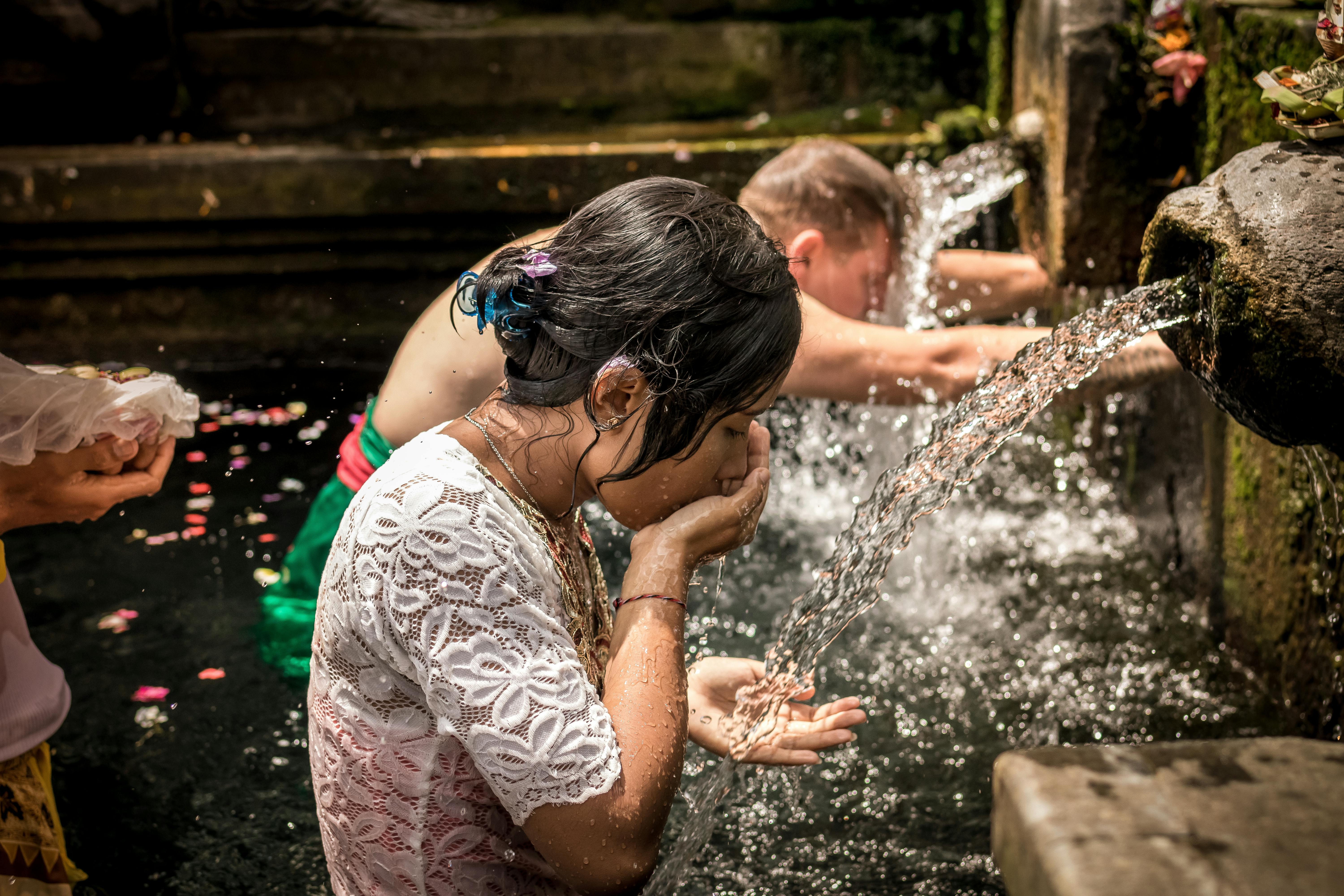 Free Man and Woman Bathing on Running Water Stock Photo