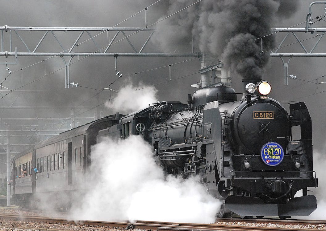 Free Black Train on Rail and Showing Smoke Stock Photo