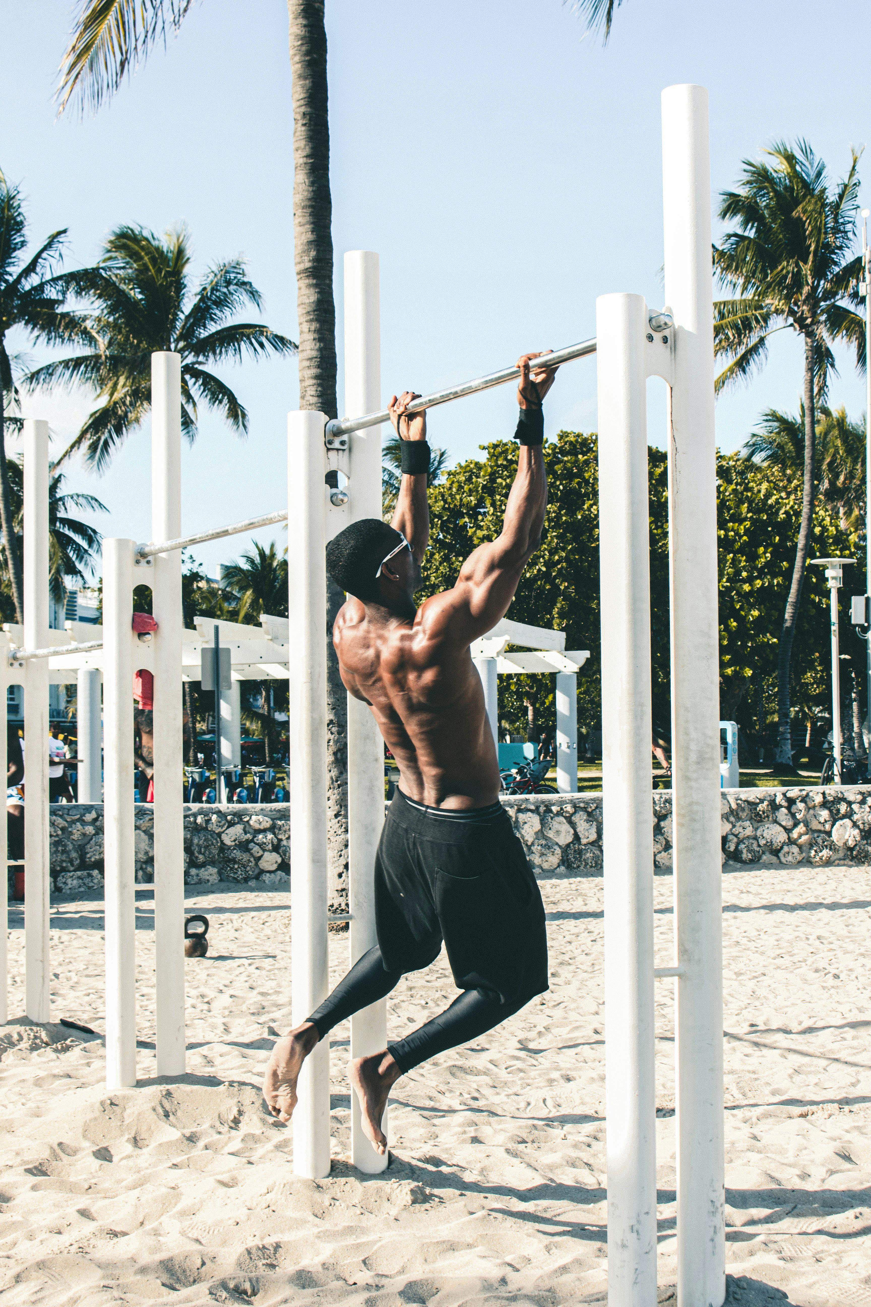 man on pull up bar