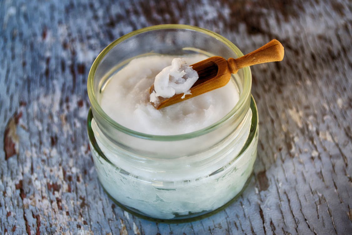 Free Clear Glass Container with Coconut Oil Stock Photo