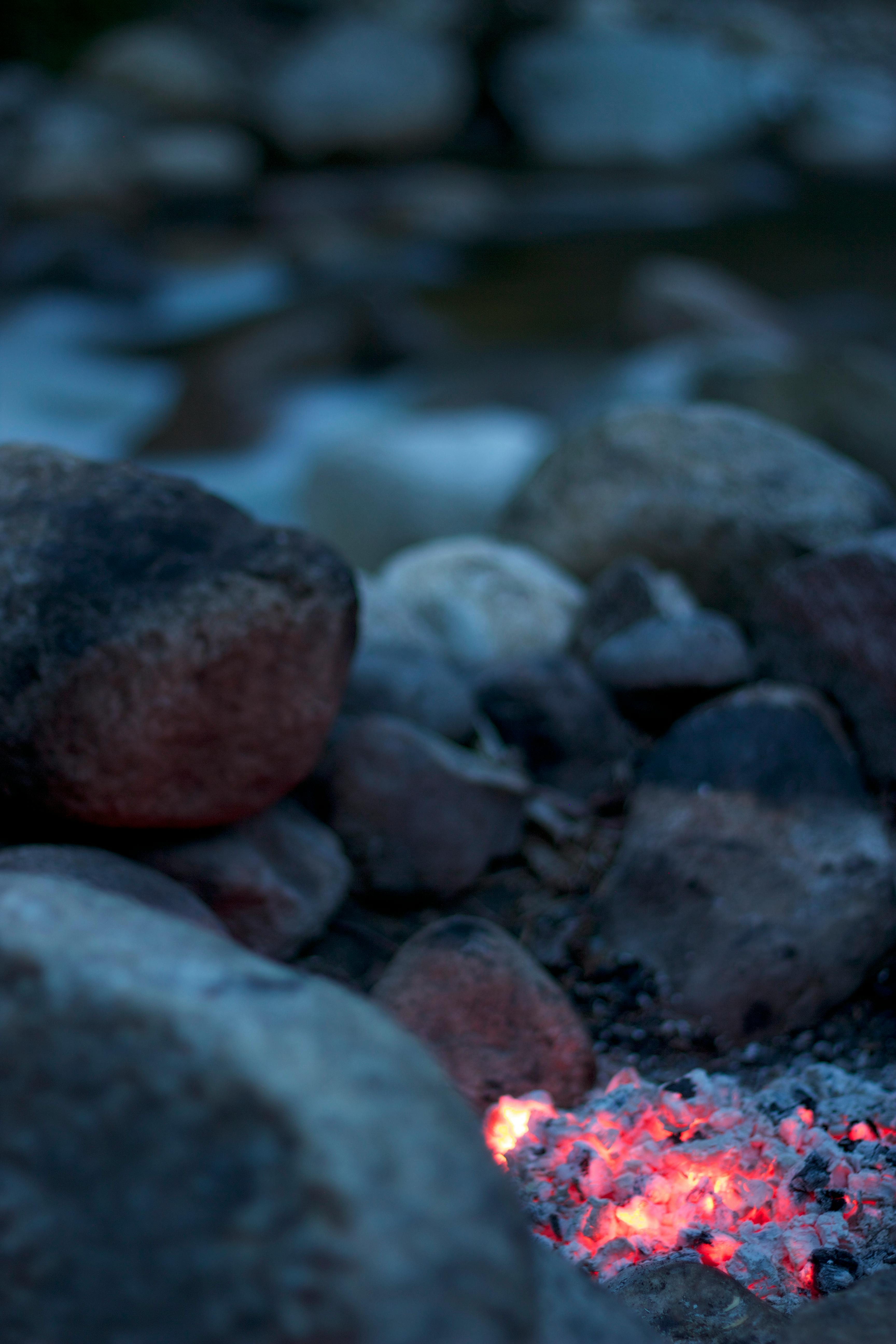 Burning Firelog Surrounded of Pebbles · Free Stock Photo