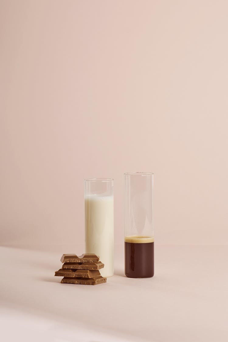 Flasks With Cocoa And Milk Near Chocolate