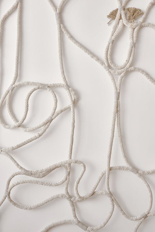 Free Tied rope decorating light wall in room Stock Photo