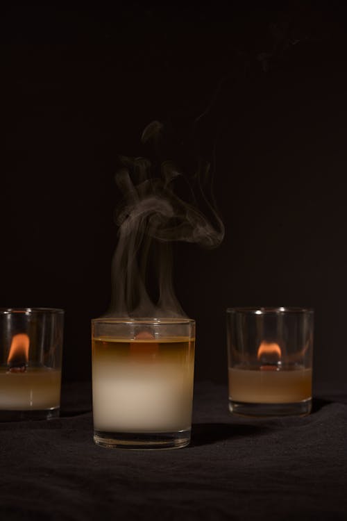 Burning candles with smoke for aromatherapy