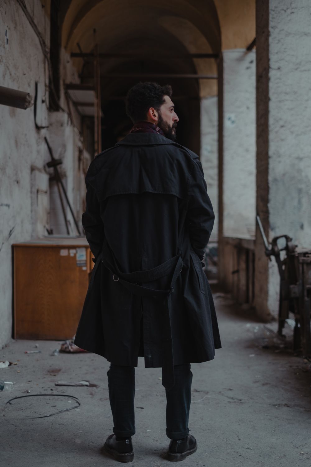 Anonymous man standing in abandoned house · Free Stock Photo