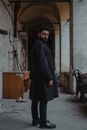 Man in Black Coat Looking Back
