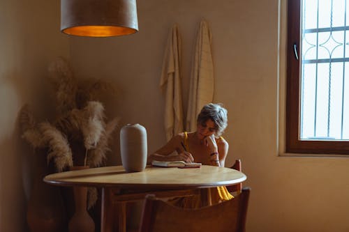 Elderly Woman Busy Writing
