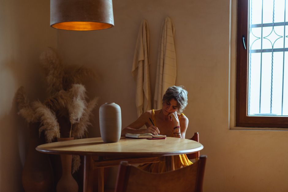 journal and lamp on desk natural light lifestyle photo 2