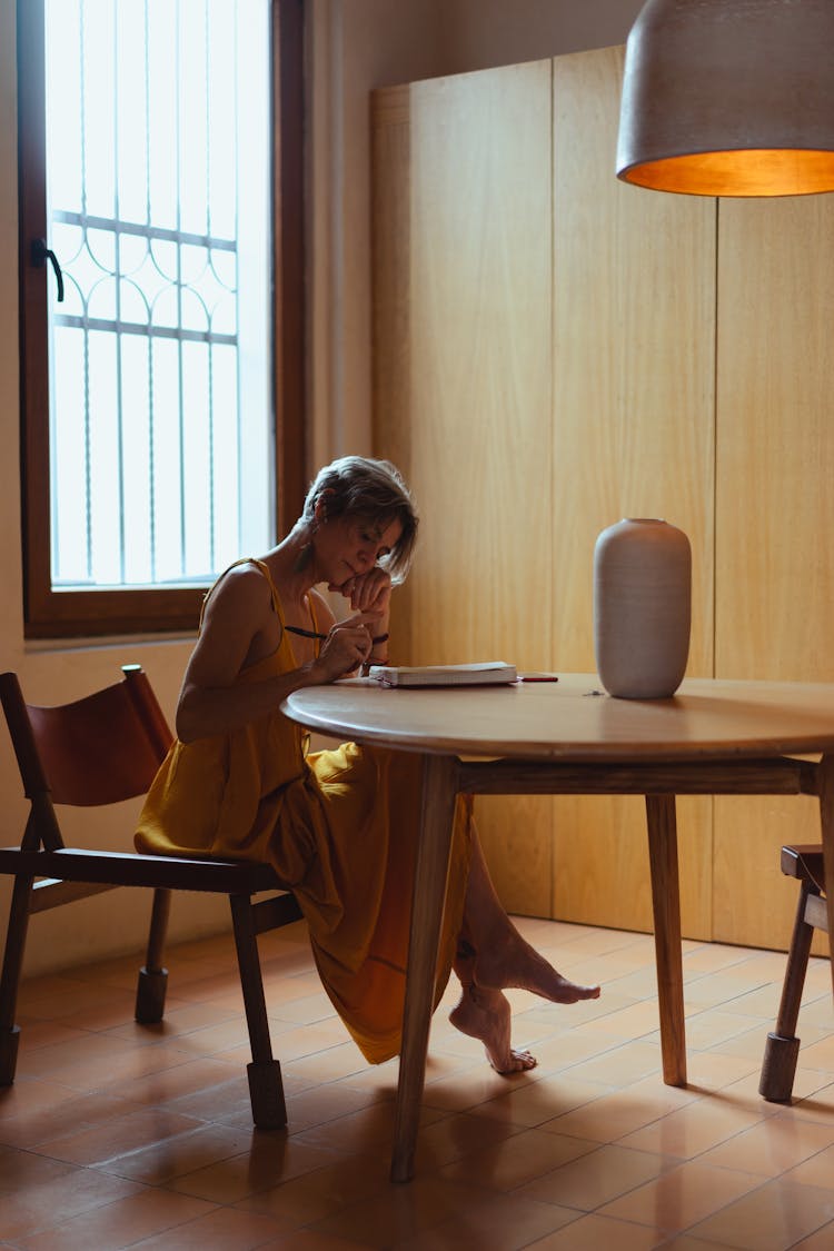 Elderly Woman Busy Writing