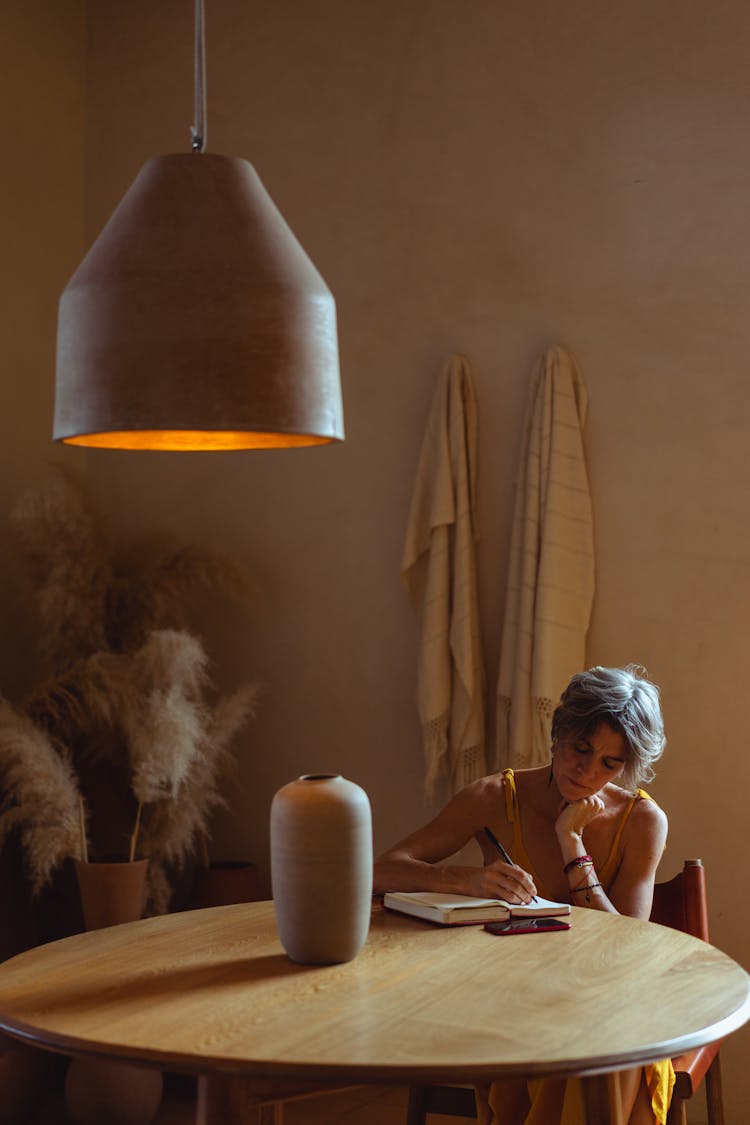 Elderly Woman Busy Writing