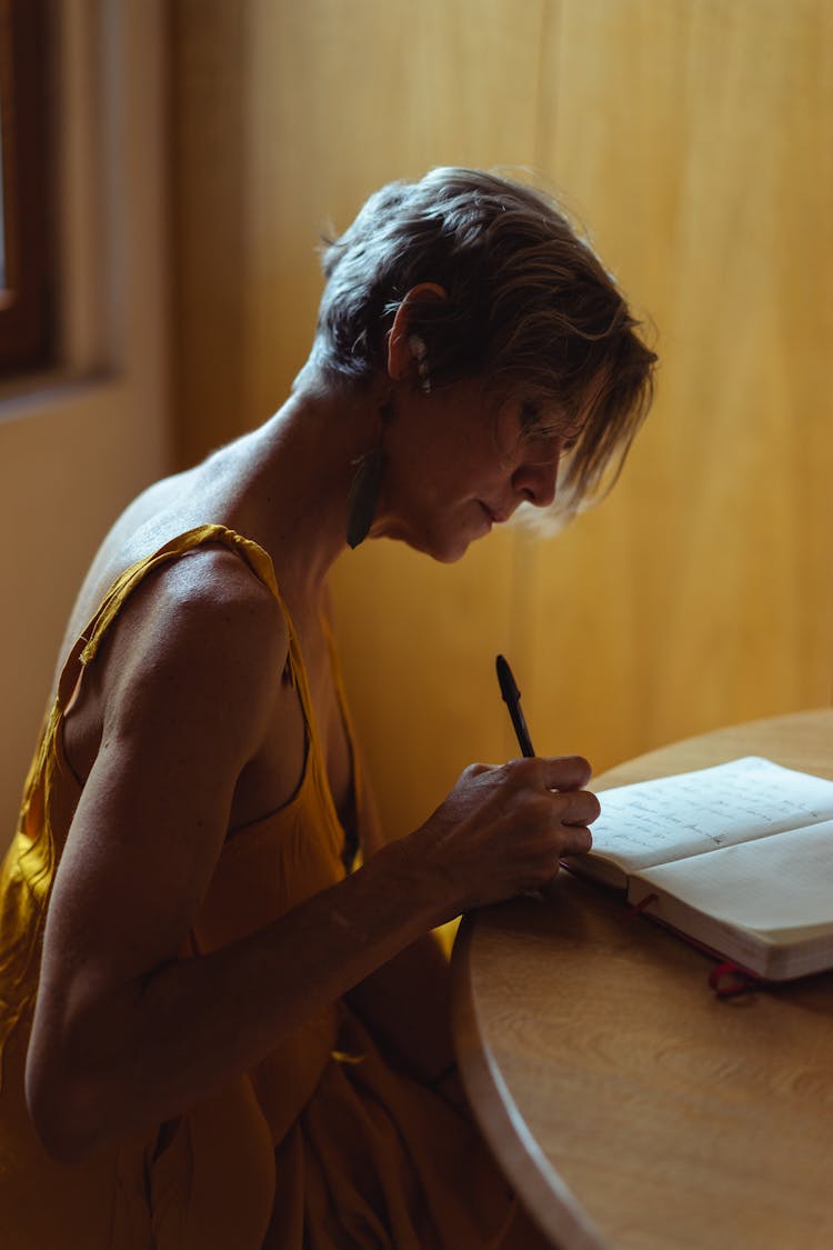 Elderly Woman Busy Writing