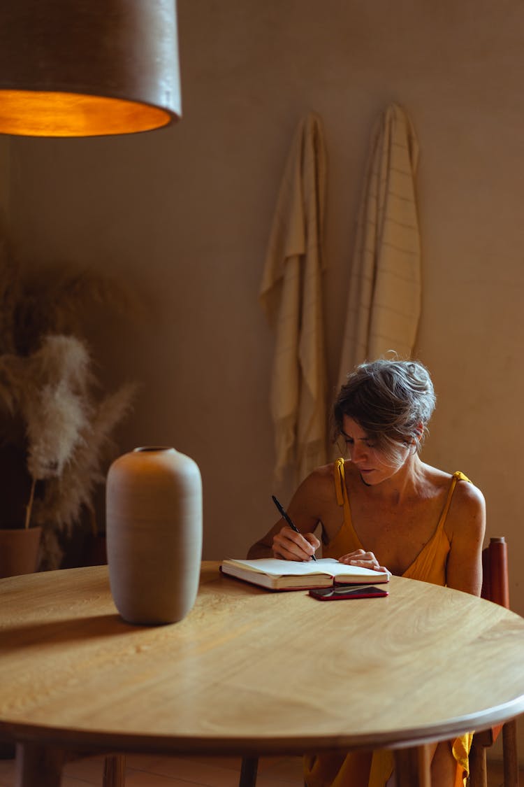 Elderly Woman Busy Writing