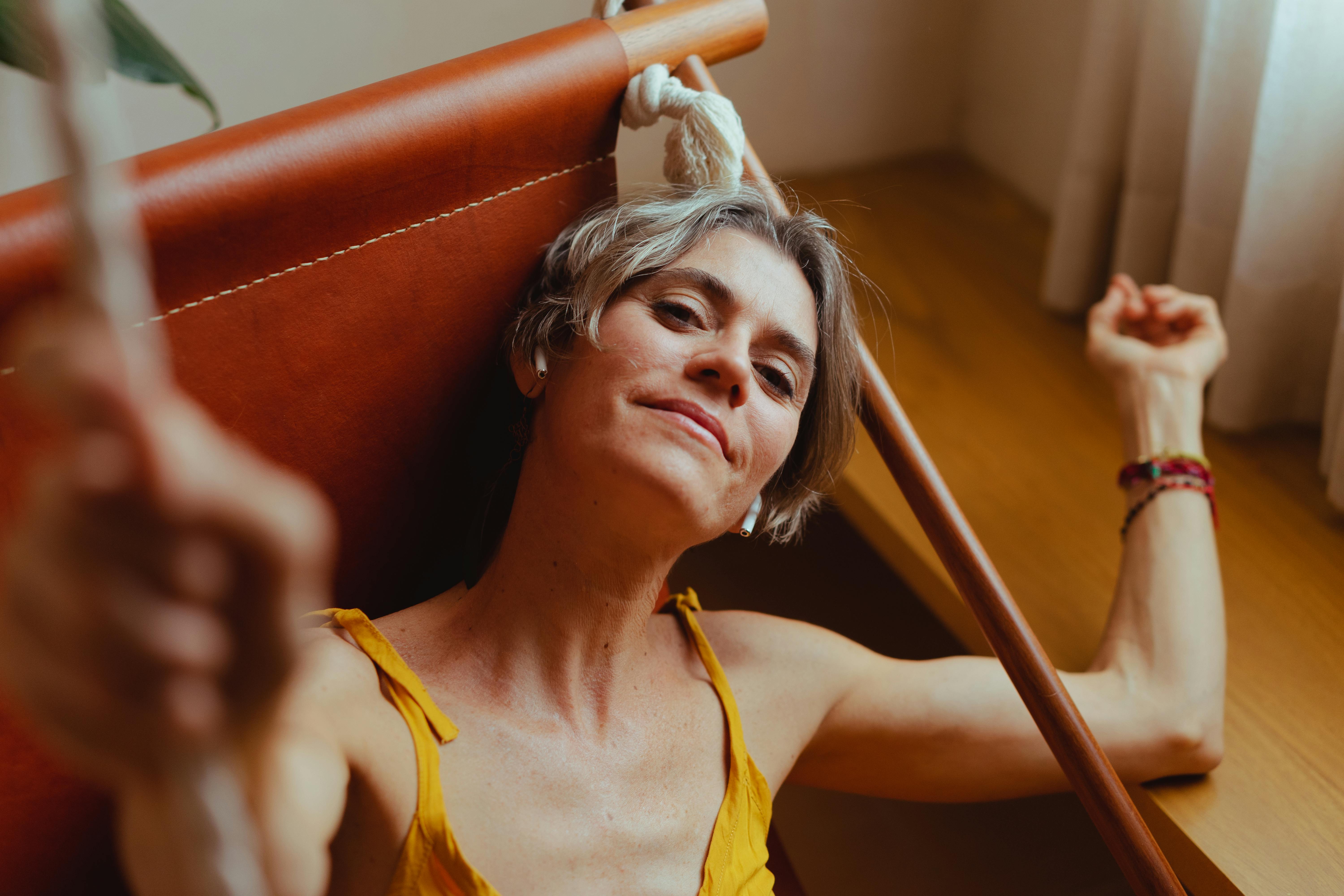 elderly woman relaxing on her hammock