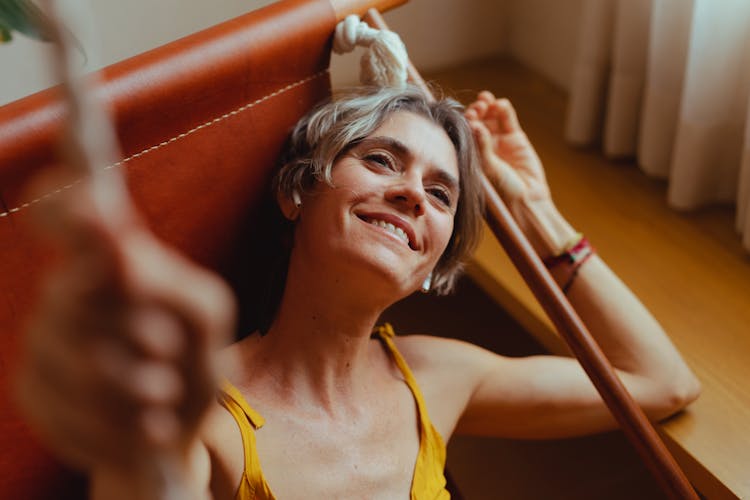 Elderly Woman Relaxing On Her Hammock