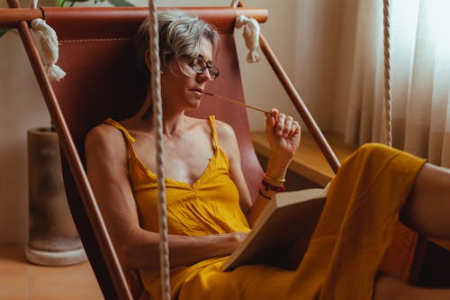 Free Elderly Woman Reading a Book Stock Photo