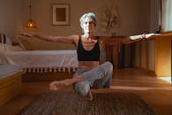 Elderly Woman Meditating Inside the Room