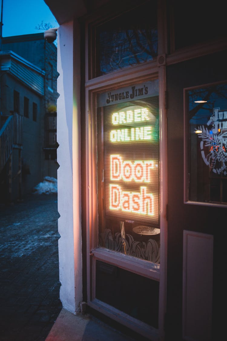 Neon Signage On Wooden Door 