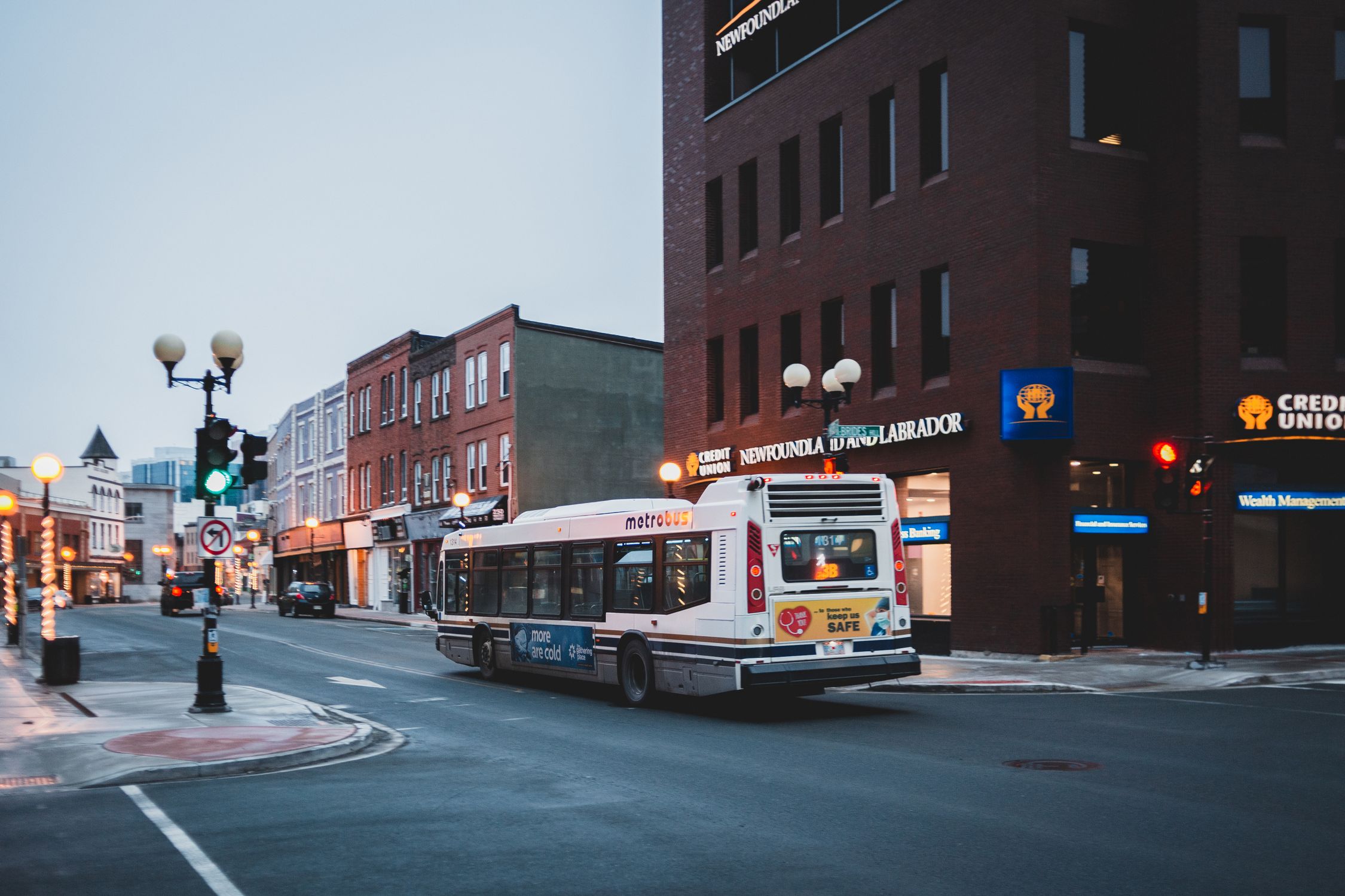 City street with bus driving on asphalt road · Free Stock Photo
