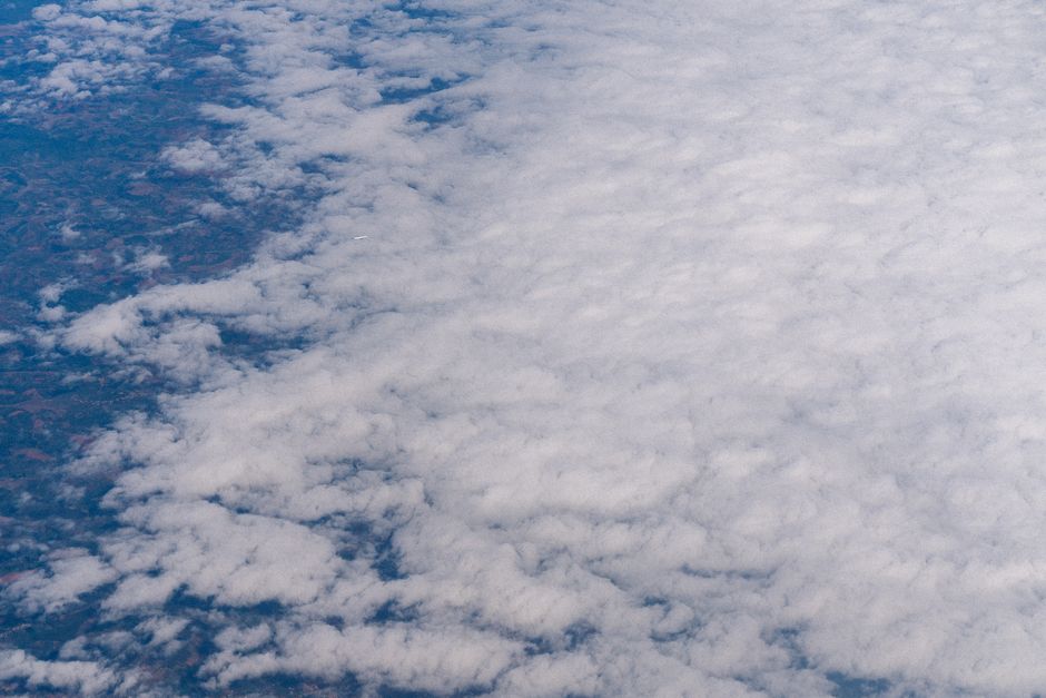Expansive aerial view of clouds showcasing a serene sky and natural beauty.