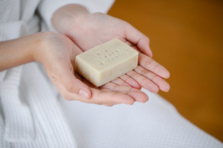 Crop Woman In Robe With Natural Shampoo Bar