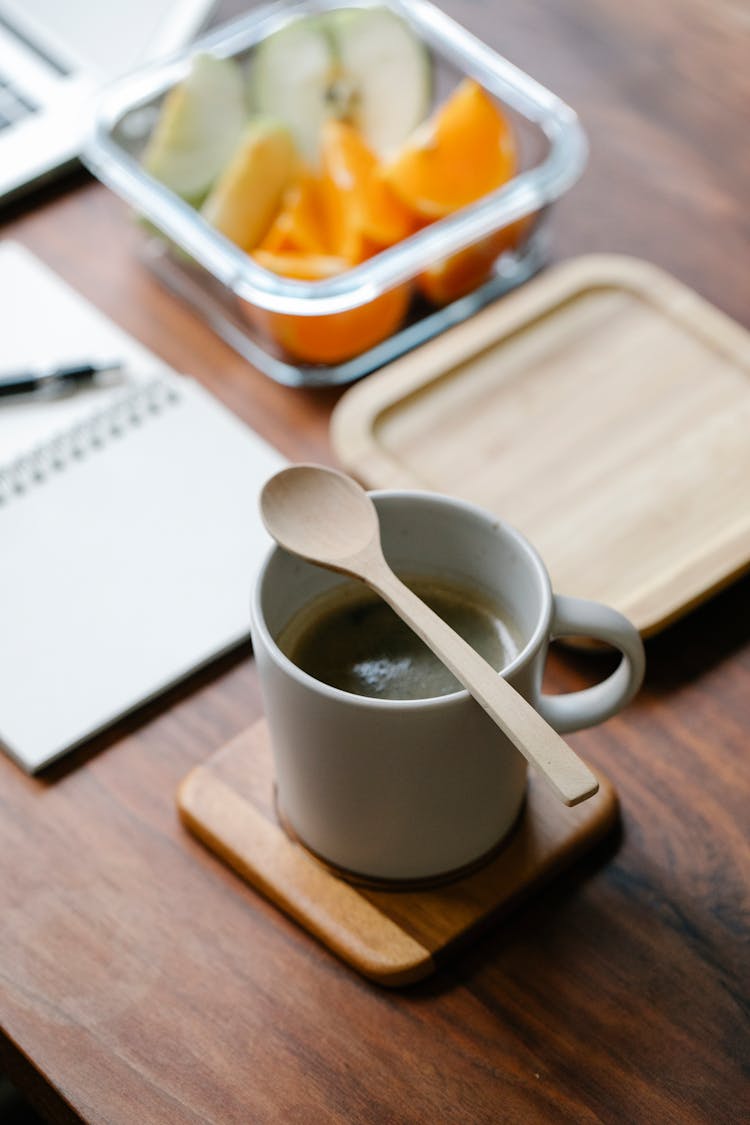 Organic Spoon On Mug Of Coffee On Coaster