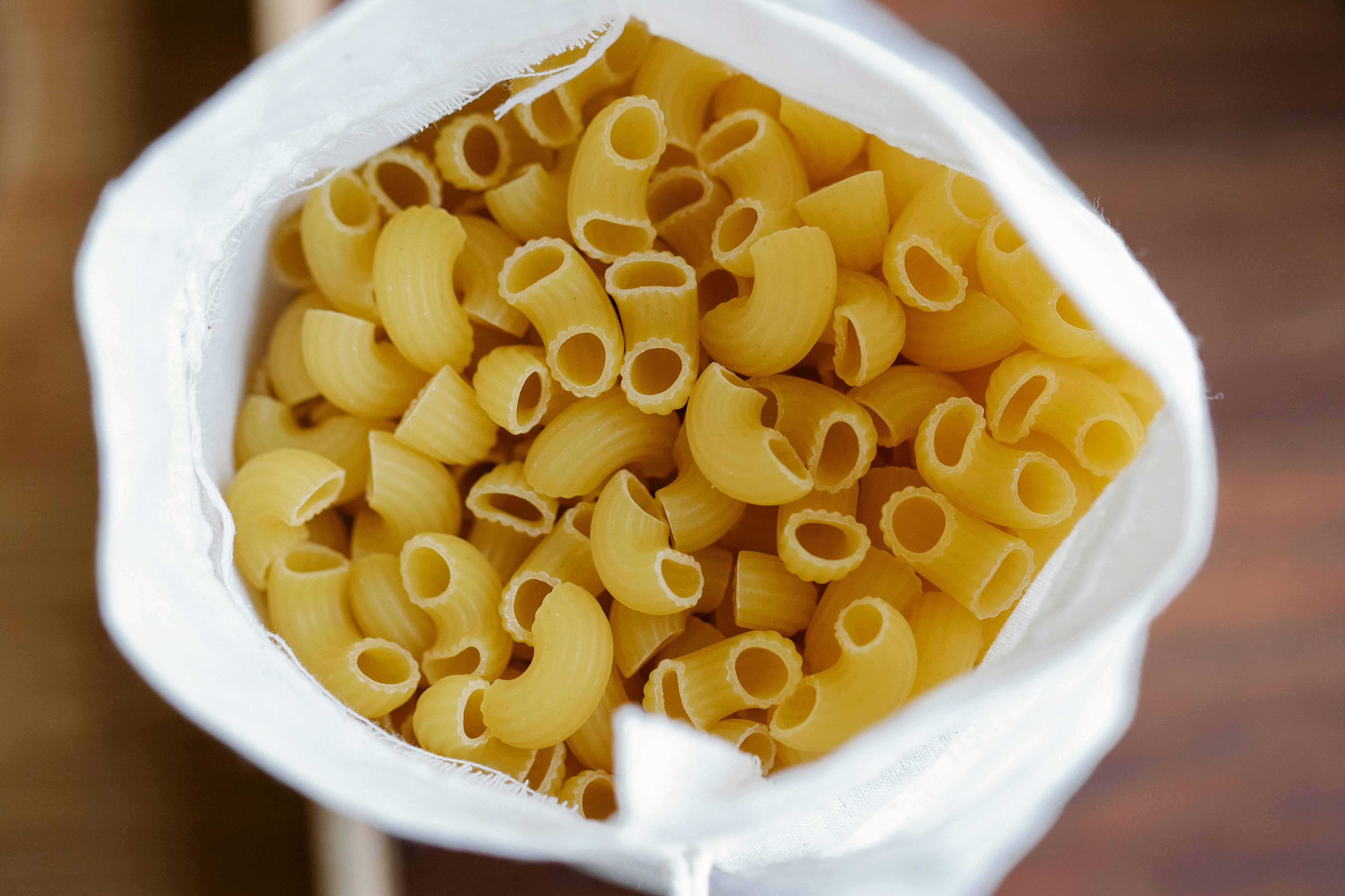 heap of raw pasta in sack